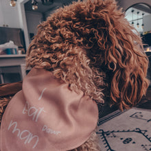 Load image into Gallery viewer, Small dog wearing Jurassic park inspired dog bandana with adjustable belt buckle collar, pink colored with white writing which reads &quot;I eat man&quot;
